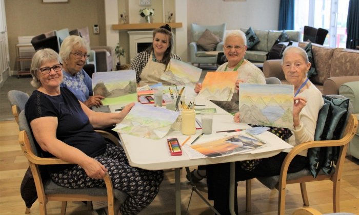 Trainee Community Support Worker runs art classes for tenants