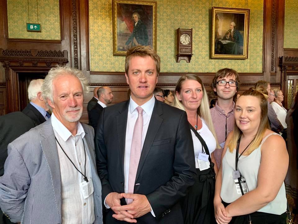 Tenants and staff join Bury North MP James Frith.