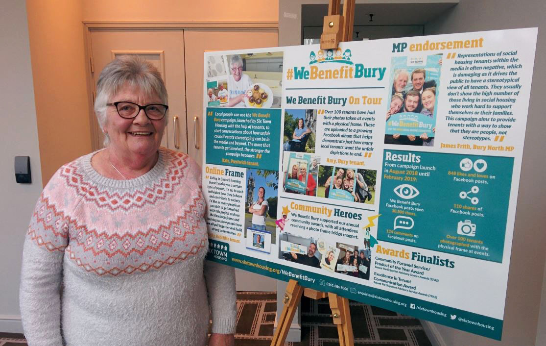 Kate with a board at the conference, containing facts about We Benefit Bury
