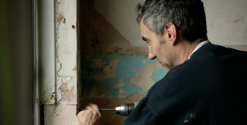 A man carrying out a repair for Six Town Housing's Repairs Direct team.
